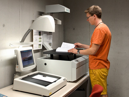 student at scanning machine