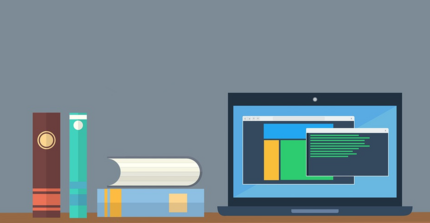 desk with books and laptop