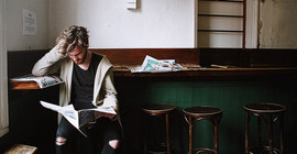 student reading newspapers