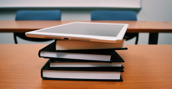 desk with tablet and books